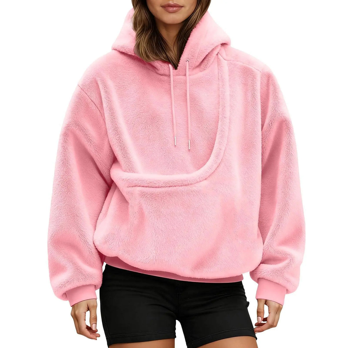 Front view of the pink pet carrier pouch hoodie showing the curved front pouch and drawstring hood