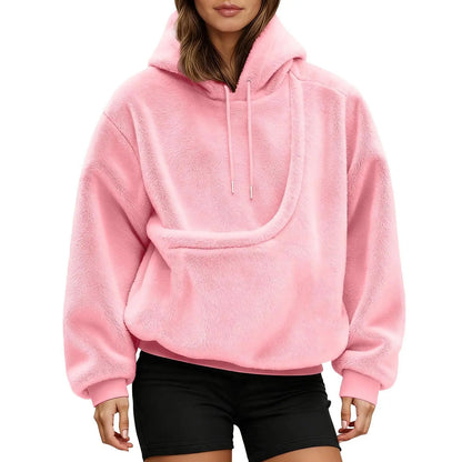Front view of the pink pet carrier pouch hoodie showing the curved front pouch and drawstring hood