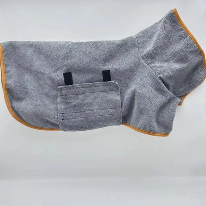 Gray dog bathrobe with orange trim laid flat, showing the high collar and chest panel