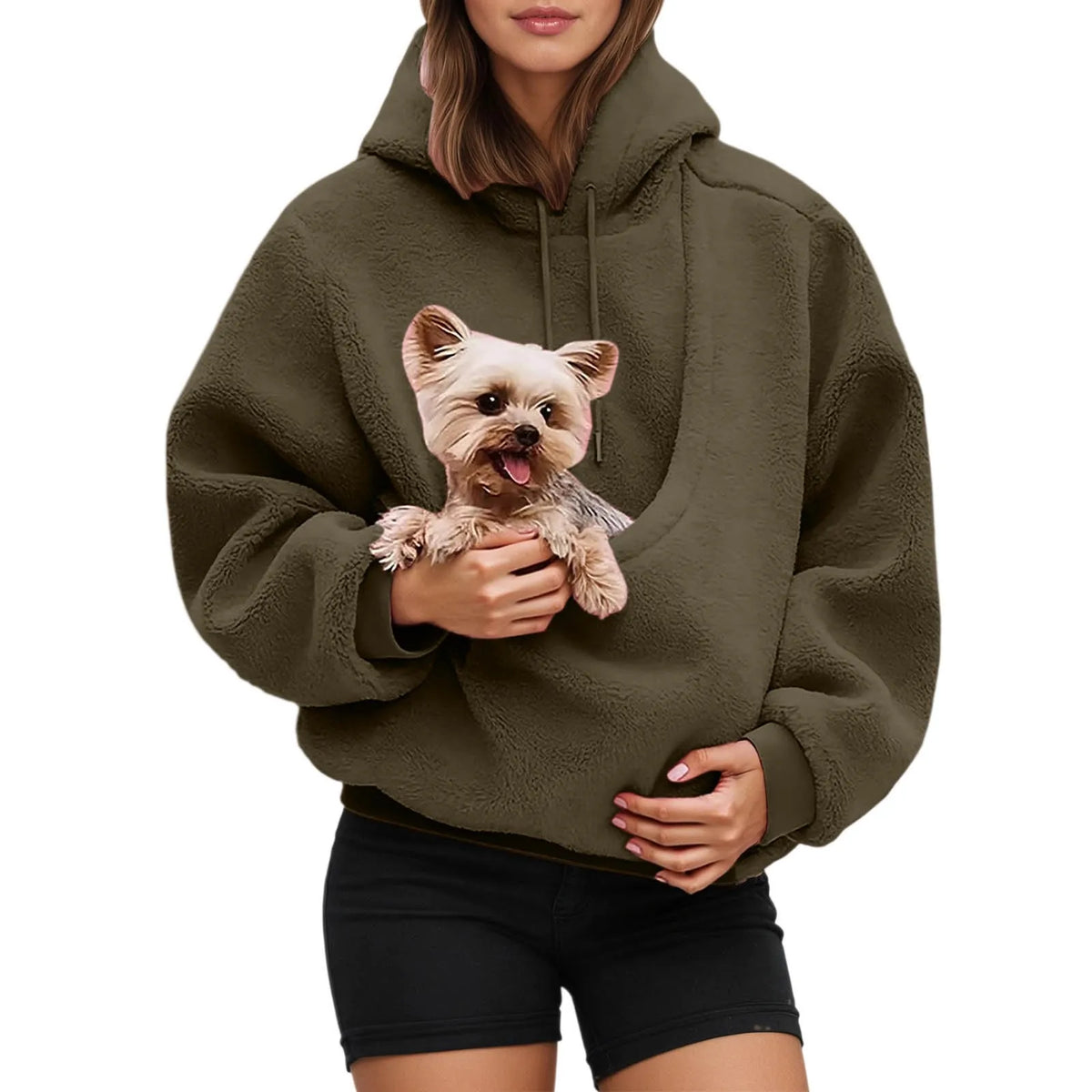Person wearing the olive fleece pouch hoodie with a small terrier held in the front pouch